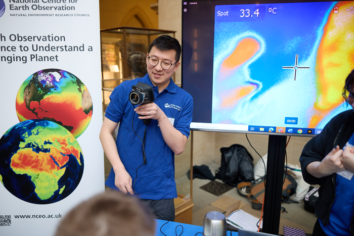 Scientist demonstrating a thermal camera